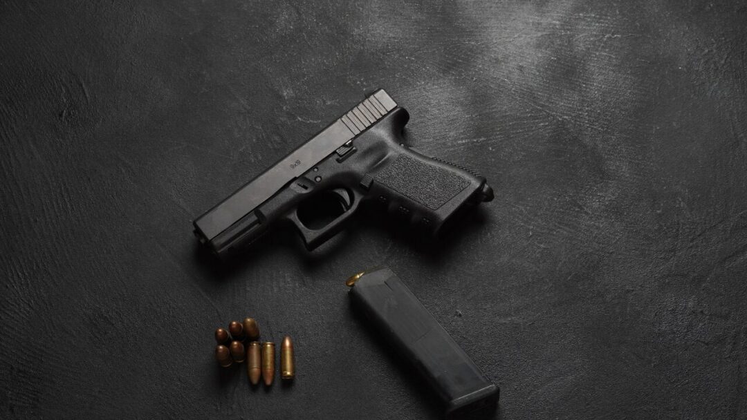 Modern semiautomatic Glock handgun representing modern firearms and ammo use.